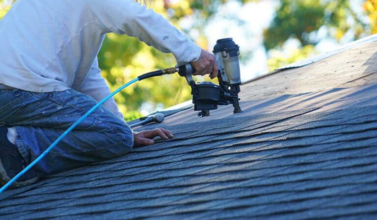 A close-up photo of soffit vents and fascia boards along a residential roof edge, showing clean, intact materials.